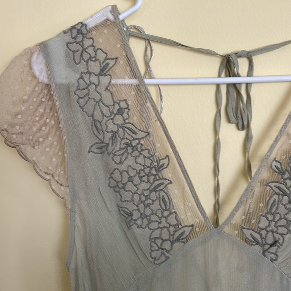 Sheer sage green blouse with embroidered details